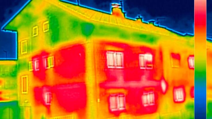 Infrared thermovision image showing lack of thermal insulation on House with or without facade